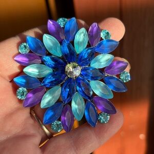 starburst/floral brooch layered marquise-cut rhinestones blue,teal,purple.